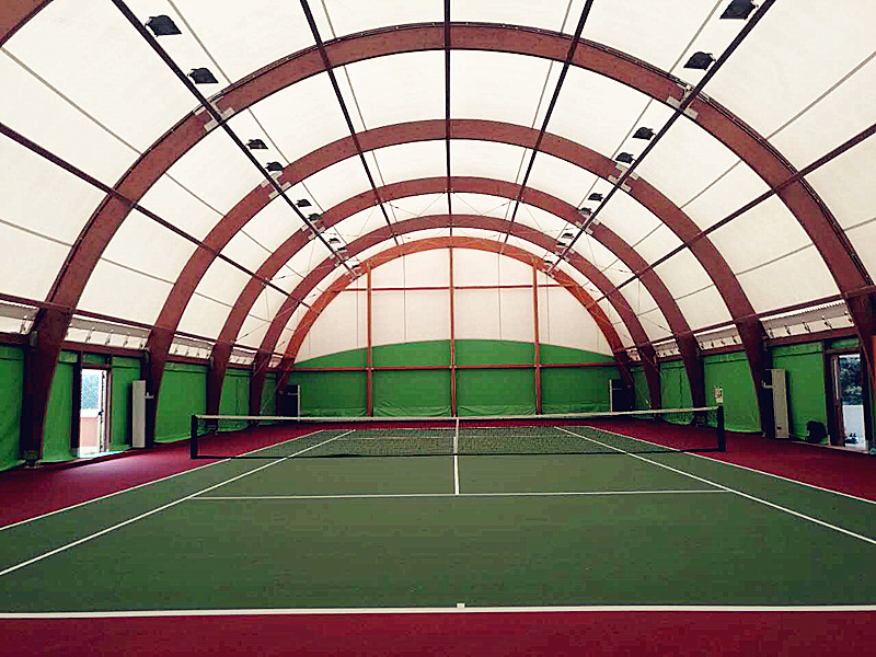 Why use a wooden structure to support the tensile fabric roof?